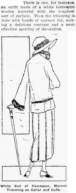There is one, for instance, an outfit made of a white homespun woolen material with the roughest sort of surface. Then the trimming is done with bands of marmot fur, making a delicious contrast and a most effective spotting of decoration. Image: illustration of a woman wearing a hat and a skirt and a coat trimmed with marmot fur with a walking stick. Caption: White Suit of Homespun, Marmot Trimming on Collar and Cuffs.